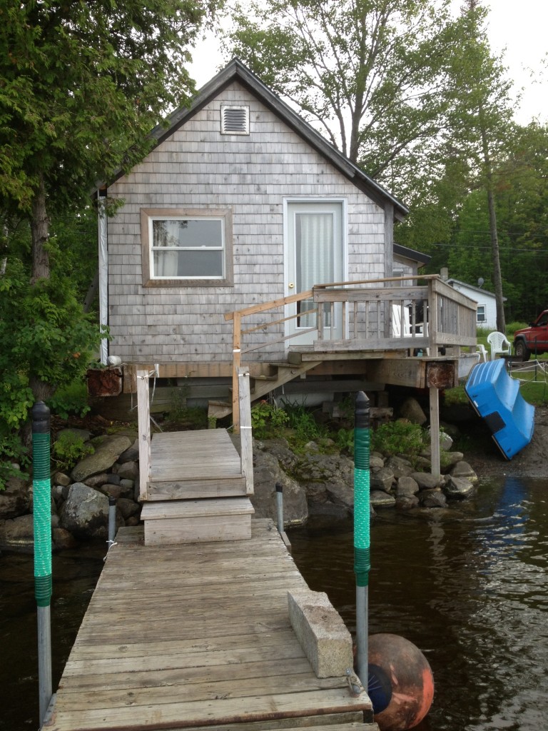 Cottage front door opens onto the large dock